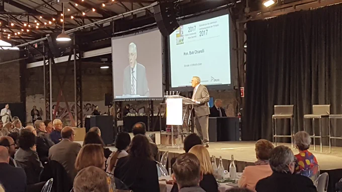 Bob Chiarelli, Ontario Minister of Infrastructure making an announcement at the 2017 Community Hubs Summit.