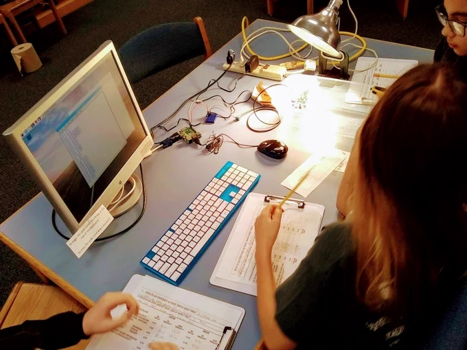 students using computer code to monitor temperature