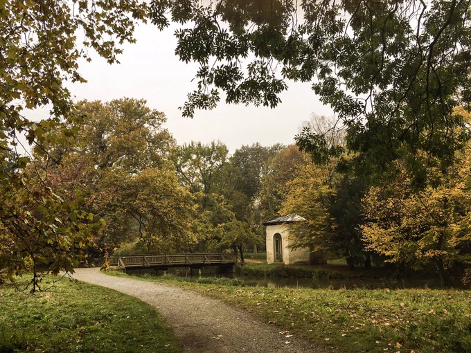 A walking path goes over a bridge in Harrach Park.