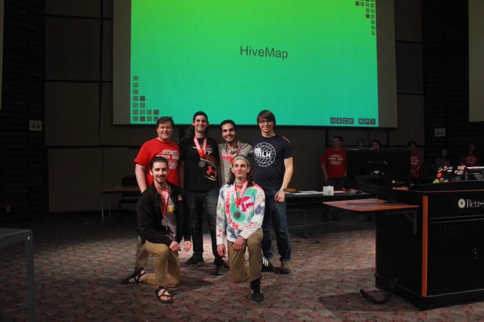 Hackers, organizer, and MLH Coach with prizes and medals