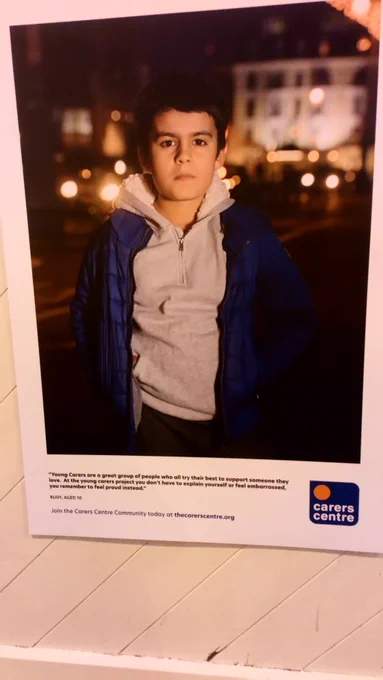 Image of young carer standing in street