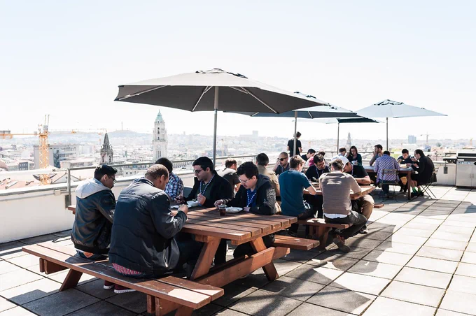 People having lunch in Mindera's terrace at workshop day of typeof conf