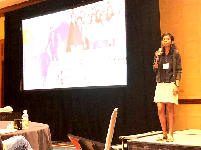 Vidya presenting at a conference.