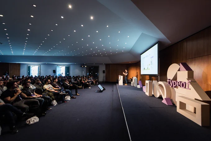 Wide shot of florian Rival speaking at typeof conf