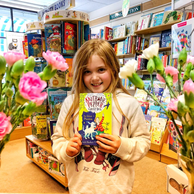 Young reader with Knitbone Pepper at Harbour Bookshop Kingsbridge Devon