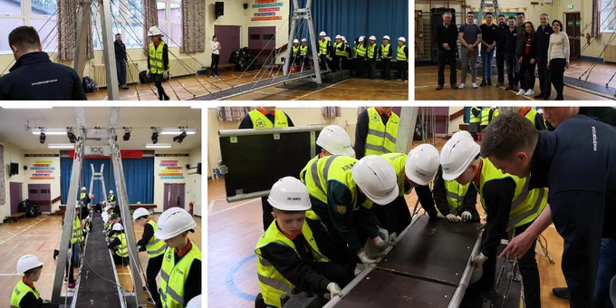 Pupils and volunteers building bridge