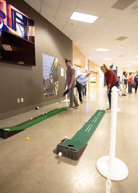 Cisco employees participating in the US Open activities in the employee cafe.