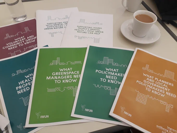 Colourful A4 briefs for different stakeholders spread out on a table