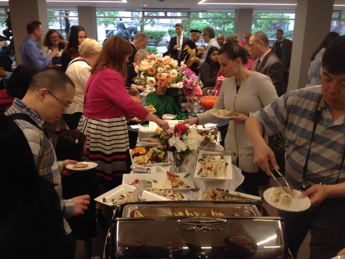 Guests grab food from a buffet.