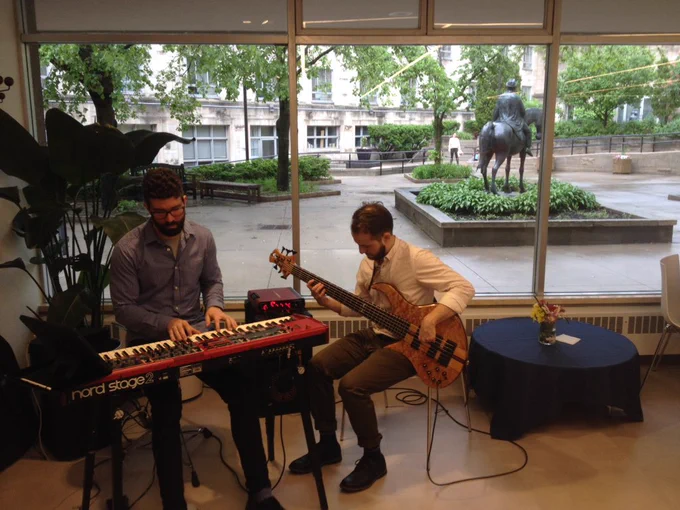 A keyboardist and bassist perform in the Coop.