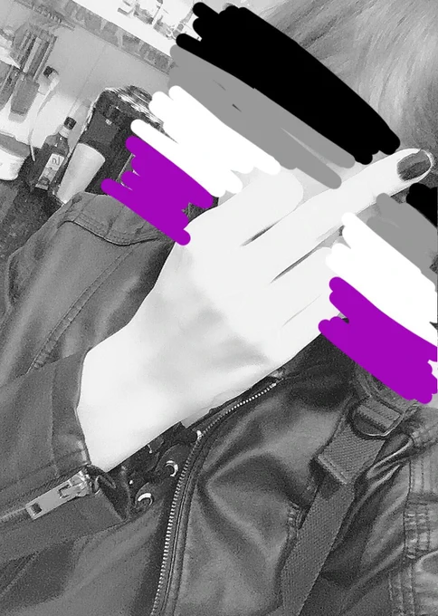 another black and white selfie with me giving the middle finger because i’m just frustrated and the asexual flag scribbled on my face covering it