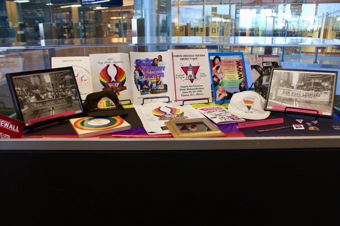 A glass case of LGBT  archived materials.