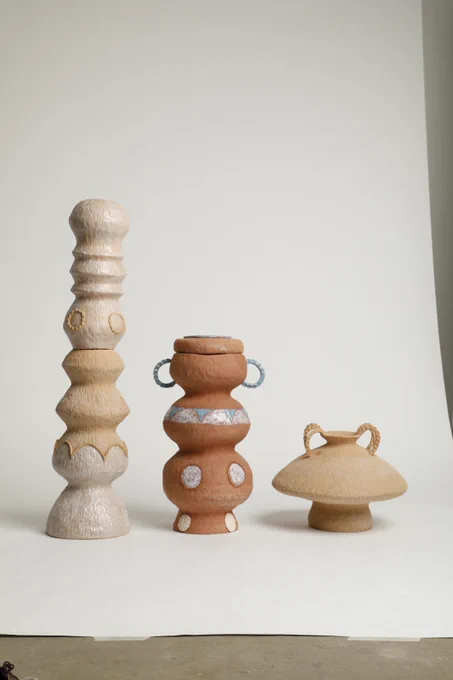 Three ceramic vases side by side