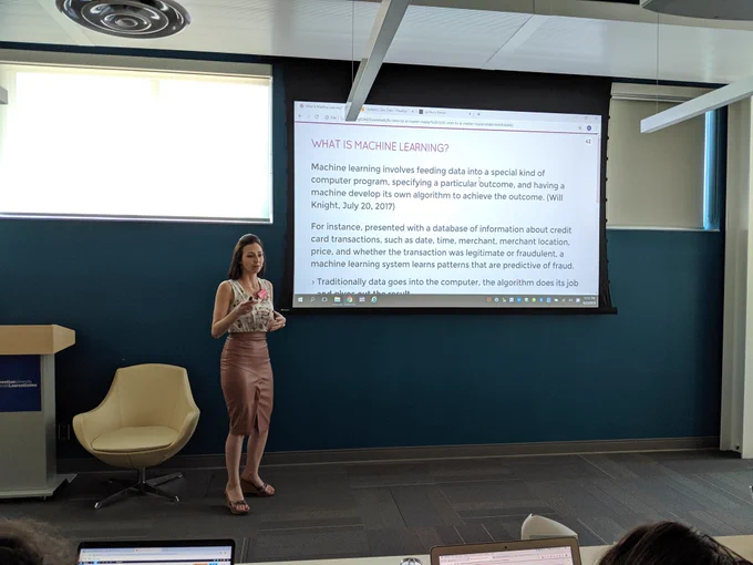 Renee Higgins in front of a machine learning slide