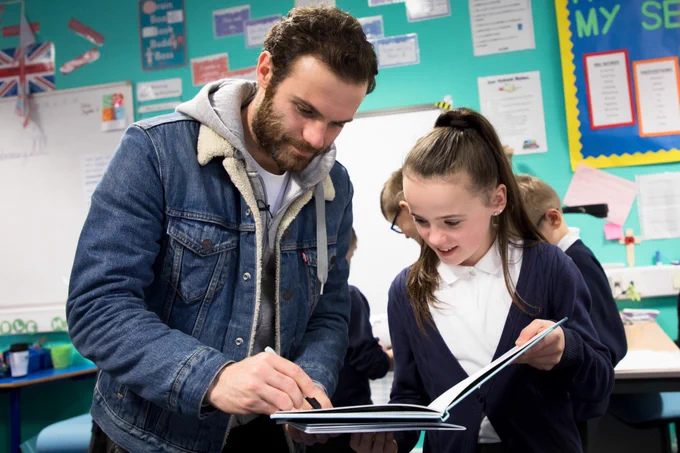 Juan Mata donates Spanish books to Royton Hall Primary School to celebrate World Book Day