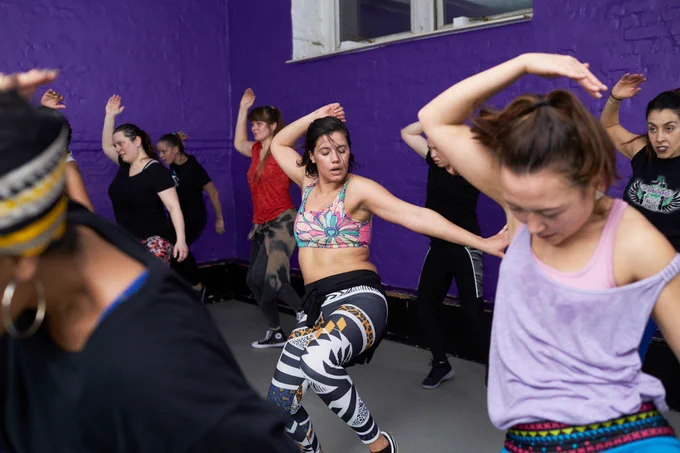 A group of women in the middle of an energetic fitness session.