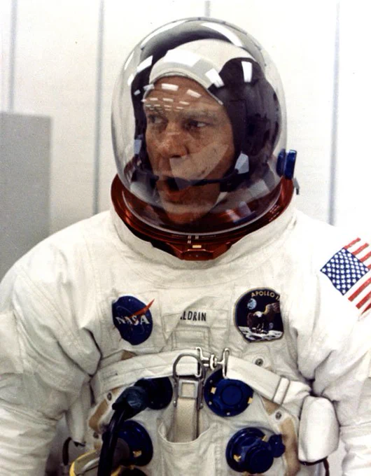 Astronaut Buzz Aldrin yawns during pre-launch preparations