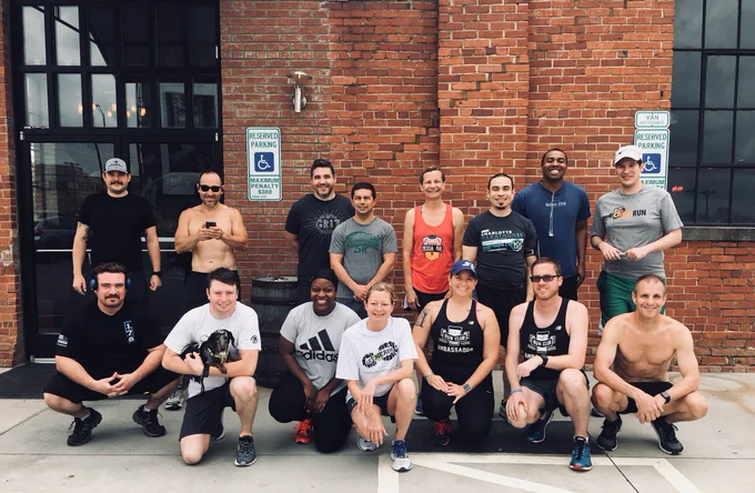 Group of 15 handsome and beautiful individuals posing for a photo before we start running on a Sunday afternoon.