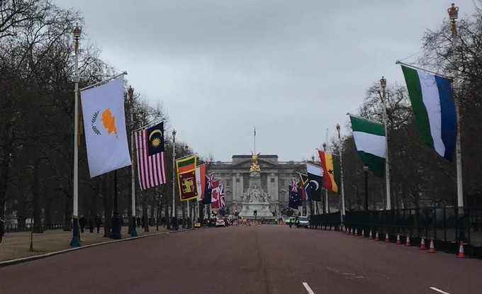 The flags of the Commonwealth fly down the Mall