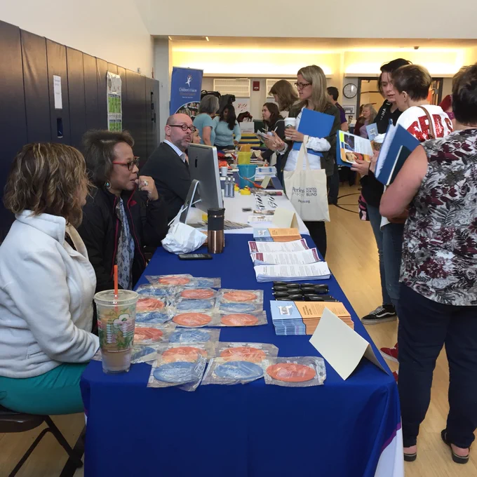 Visitors at exhibitor tables