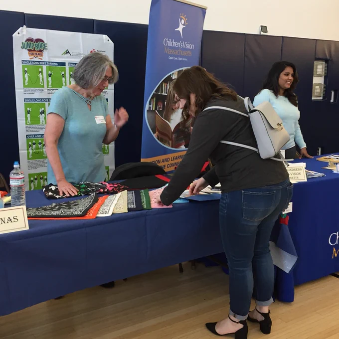 Parents signing up for raffle at exhibitor tables
