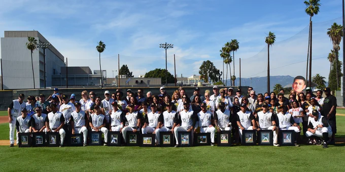 Picture of all of the seniors and their families on senior day at Reeder Field.