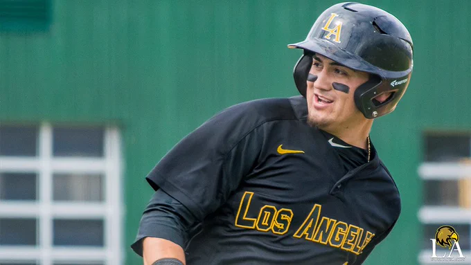 Baseball player Anthony Ayala smiles while running the bases.