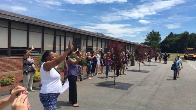 Staff Waving to Students