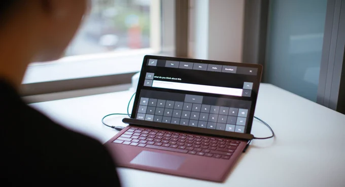 Surface laptop with eye control keyboard on the screen.