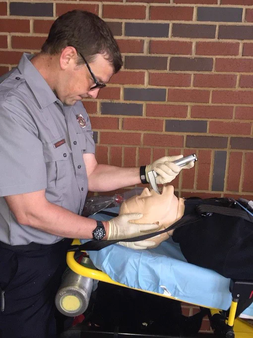 The classic position for performing intubation is with the patient supine and at your xiphoid—this position allows the entire left arm to contribute to laryngos-copy while affording a direct view of the patient’s mouth and airway. Photo courtesy Henry E. Wang