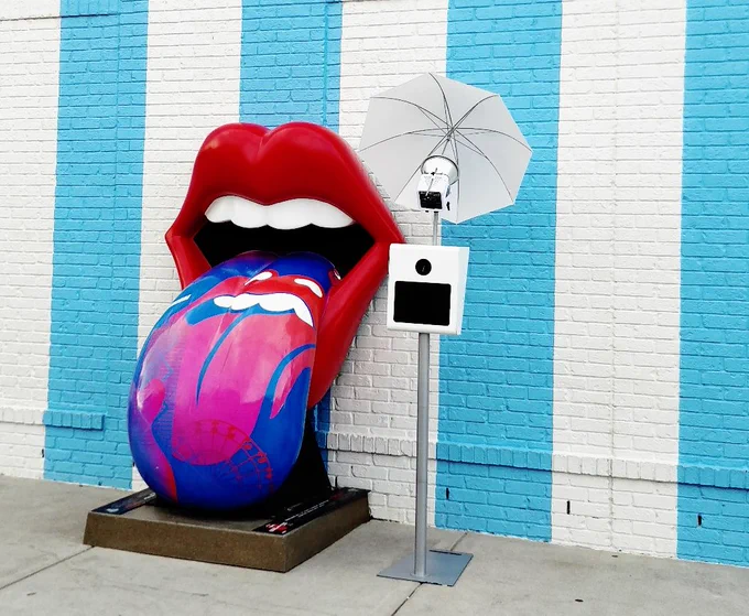 White photobooth in front of colorful background