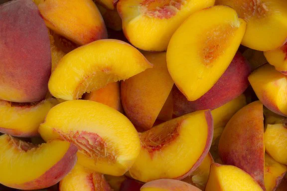 Fresh peach slices close up