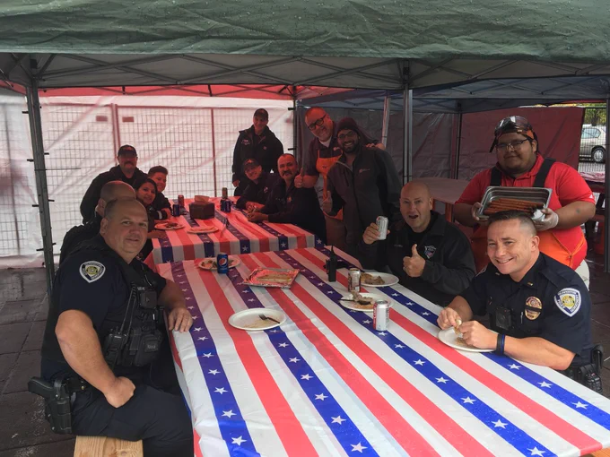 Officers and firefighters taking a moment to enjoy an awesome lunch.