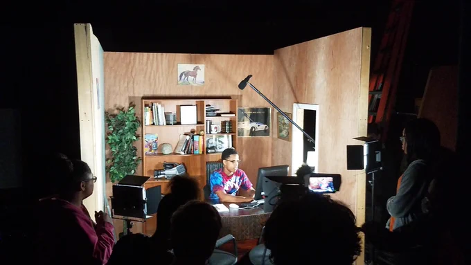 On set while students record film project