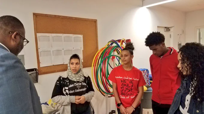 Dr. Repollet speaking with high school students