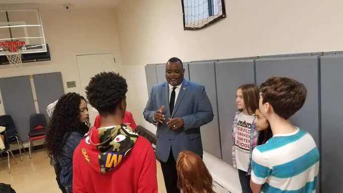 Dr. Repollet and the students.