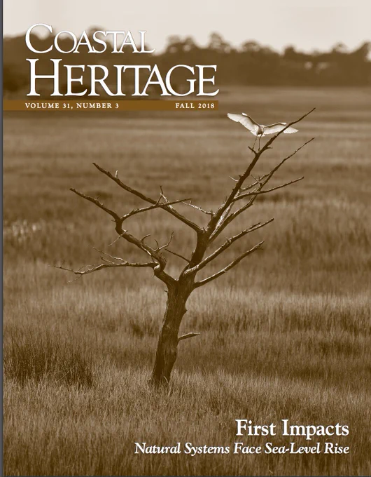 The image shows the cover of the Fall 2018 issue of Coastal Heritage magazine, with a white heron lighting on a dead tree snag surrounded by coastal marsh.
