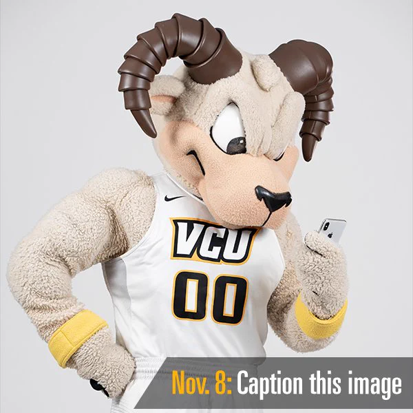 Text reads "Nov. 8: Caption this image" over a photo of VCU mascot Rodney the Ram looking at his cell phone.