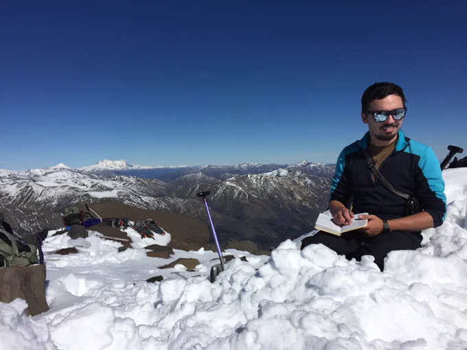 PhD Candidate Stephen Maples makes notes at the top of a Chilean range.