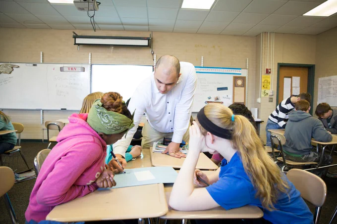 A Spartan educator illustrates a math lesson in the classroom.