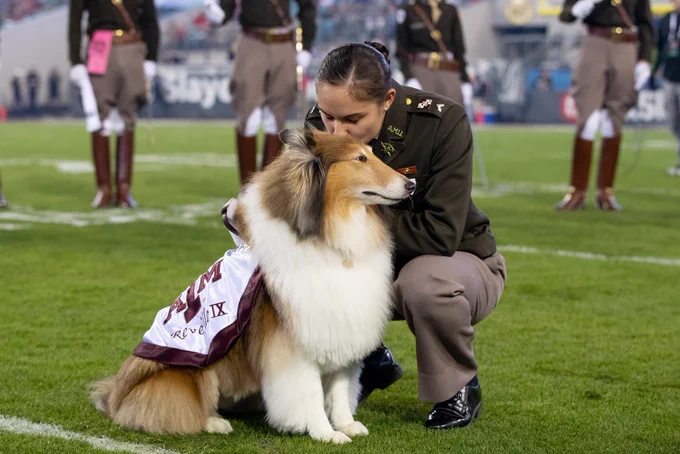 Mia Miller kisses Reveille on the head