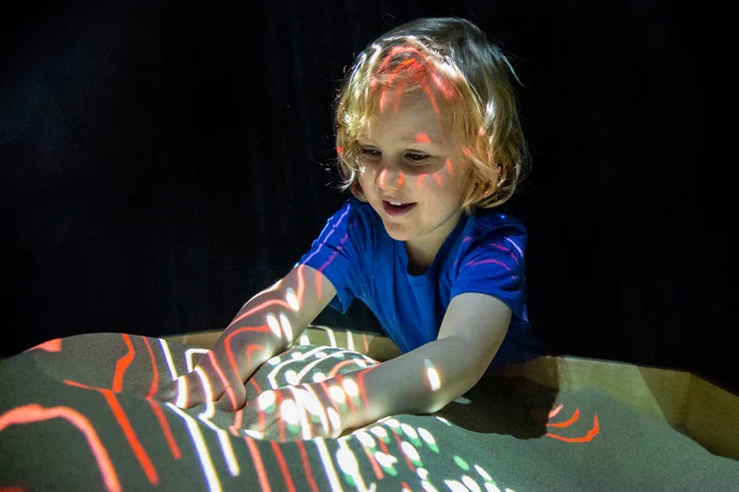 A child playing in Sound Pit at Southbank Centre