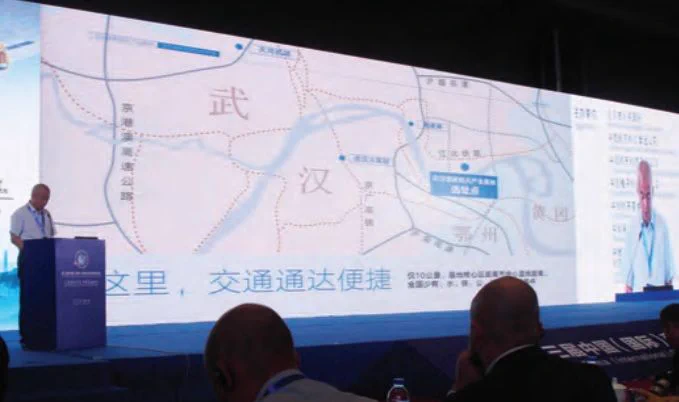 Chen Xingai is explaining the importance of the Wuhan National Aerospace Industry Base. credit: GoTaikonauts!
