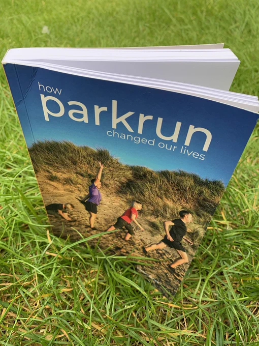 A copy of How parkrun Changed Our Lives on grass
