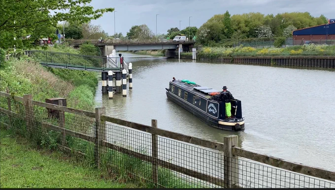 A barge navigates through the Boston Lock in the East Midlands.