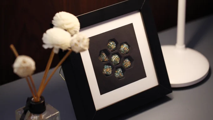The Square Dice Frame that fits 7 polyhedral dice
