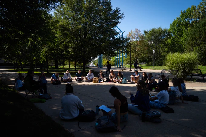A class sits outside.