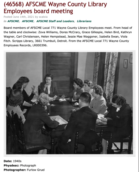 AFSCME Local 771 board members sit around a table, some of them smoking cigarettes. Screenshot from Reuther website image 46568.