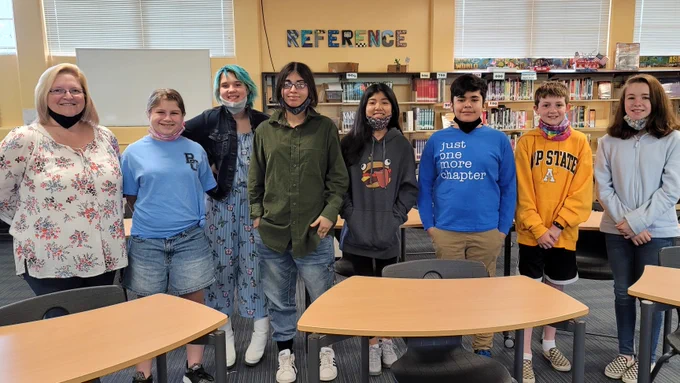 Seven students and their coach from Braxton Craven Middle School after the Battle of the Books Competition.
