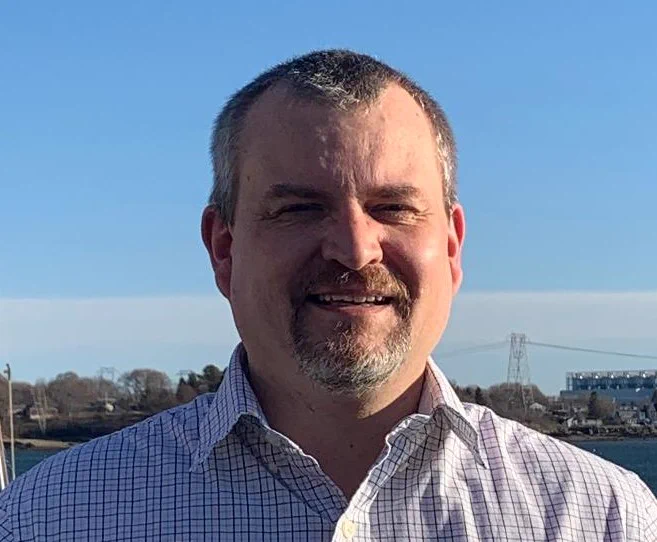 Photo of Triverus colleague Stuart Blaber outside and smiling towards the camera. 
